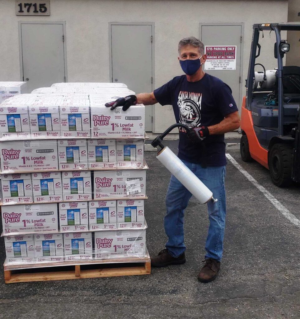 Steve Potik Wrapping Boxes of Shelf-Stable Milk